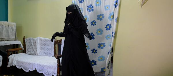 In this photograph taken on April 28, 2016, Shaista Ali, 26, at her house in Bhopal. Only three words were scrawled on the letter from her husband and posted to her parent's home in central India, but they were enough to shatter Sadaf Mehmood's life. Using an ancient and controversial Islamic practice, Mehmood's husband wrote talaq, talaq, talaq or I divorce you three times in Arabic, instantly ending his marriage of five years In this photograph taken on April 28, 2016, Shaista Ali, 26, at her house in Bhopal. Only three words were scrawled on the letter from her husband and posted to her parent's home in central India, but they were enough to shatter Sadaf Mehmood's life. Using an ancient and controversial Islamic practice, Mehmood's husband wrote talaq, talaq, talaq or I divorce you three times in Arabic, instantly ending his marriage of five years - Sputnik International