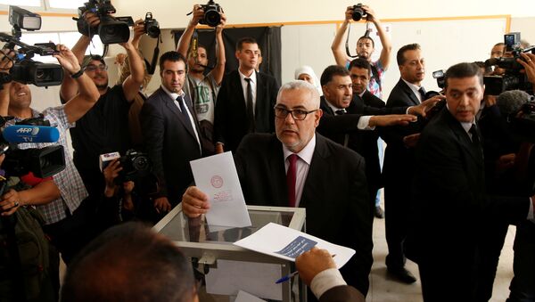 Abdelillah Benkirane, secretary-general of the Islamist Justice and Development party (PJD), casts his ballot at a polling station in Rabat October 7, 2016 - Sputnik International