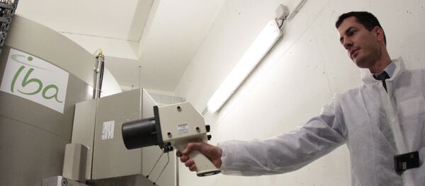A technicians participates in the manufacturing of 'radioelements' during the unveiling of the cyclotron, a production unit of isotopes used in medical diagnosis to locate cancerous cells, on November 24, 2009 in the Saint-Louis hospital in Paris A technicians participates in the manufacturing of 'radioelements' during the unveiling of the cyclotron, a production unit of isotopes used in medical diagnosis to locate cancerous cells, on November 24, 2009 in the Saint-Louis hospital in Paris - Sputnik International