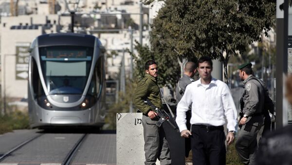 Israeli border police stand guard next to new concrete roadblocks at a tramway stop in annexed Arab east Jerusalem  (File) - Sputnik International
