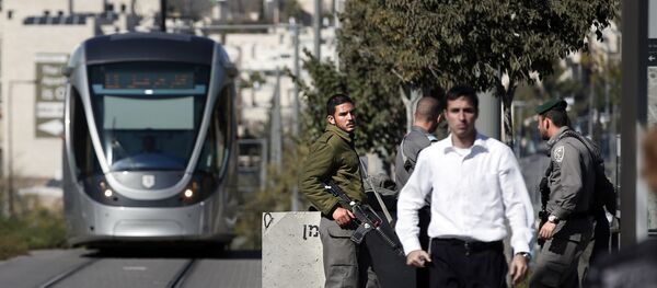 Israeli border police stand guard next to new concrete roadblocks at a tramway stop in annexed Arab east Jerusalem  (File) - Sputnik International