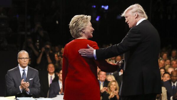 In this September 26, 2016 file photo, Democratic presidential nominee Hillary Clinton and Republican presidential nominee Donald Trump shake hands during the presidential debate at Hofstra University in Hempstead, New York. - Sputnik International