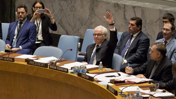 Russian ambassador to the United Nations Vitaly Churkin vetoes a Security Council vote on a French-Spanish resolution on Syria at the UN headquarters, October 8, 2016, in New York City - Sputnik International