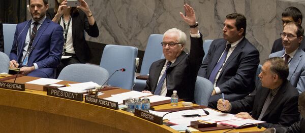 Russian ambassador to the United Nations Vitaly Churkin vetoes a Security Council vote on a French-Spanish resolution on Syria at the UN headquarters, October 8, 2016, in New York City - Sputnik International