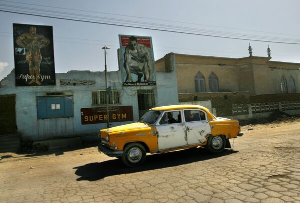 GAZ-21 taxi in Afghanistan, 2006. These cars still can be seen there on the streets, where they once again prove their reliability. - Sputnik International