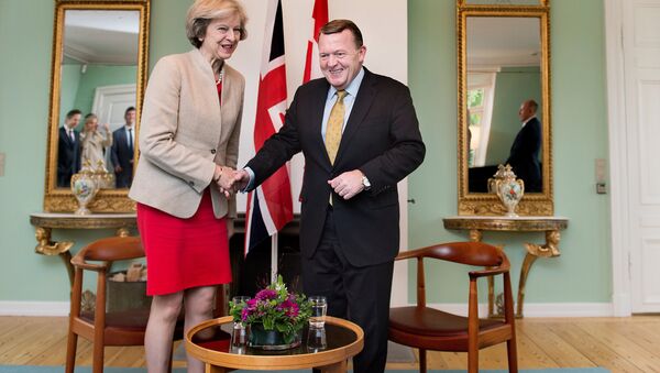 Britain's Prime Minister Theresa May shakes hands with Danish Prime Minister Lars Lokke Rasmussen, at Marienborg estate in Lyngby outside Copenhagen, Denmark, October 10, 2016. - Sputnik International