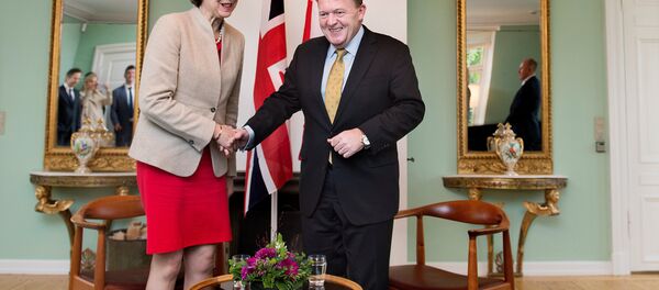 Britain's Prime Minister Theresa May shakes hands with Danish Prime Minister Lars Lokke Rasmussen, at Marienborg estate in Lyngby outside Copenhagen, Denmark, October 10, 2016. Britain's Prime Minister Theresa May shakes hands with Danish Prime Minister Lars Lokke Rasmussen, at Marienborg estate in Lyngby outside Copenhagen, Denmark, October 10, 2016. - Sputnik International