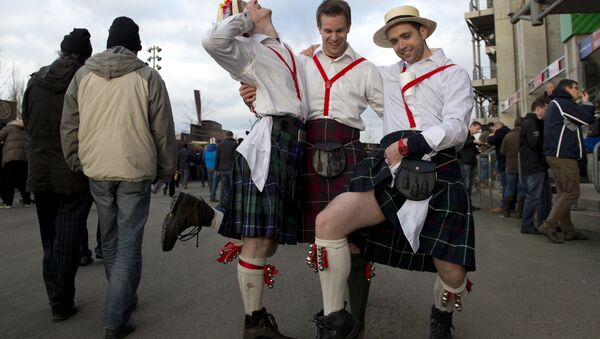 Scotland fans in kilts strike a pose before the start of the Six Nations international rugby union match between England and Scotland at Twickenham Stadium in south-west London on February 2, 2013. - Sputnik International