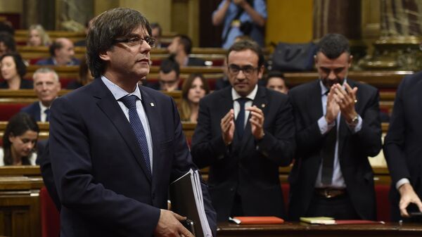 President of the Catalan regional Government Carles Puigdemont leaves after a debate on the government's question of confidence at the Parliament of Catalonia in Barcelona on September 29, 2016 - Sputnik International