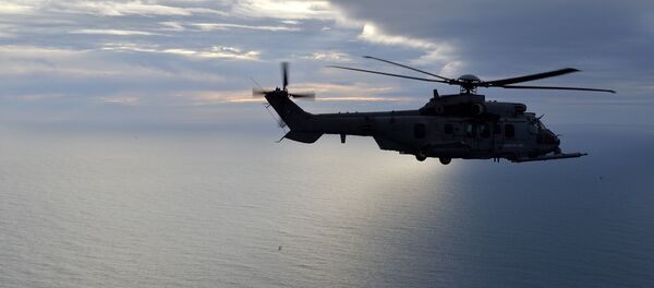 This picture taken on February 24, 2016, shows a French Caracal helicopter flying offshore during an air-to-air refuelling exercise. - Sputnik International