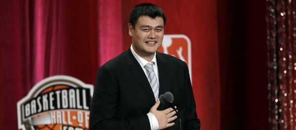 Basketball Hall of Fame indcutee Yao Ming puts his hand on his chest near his heart as he speaks during induction ceremonies, Friday, Sept. 9, 2016, in Springfield, Mass - Sputnik International