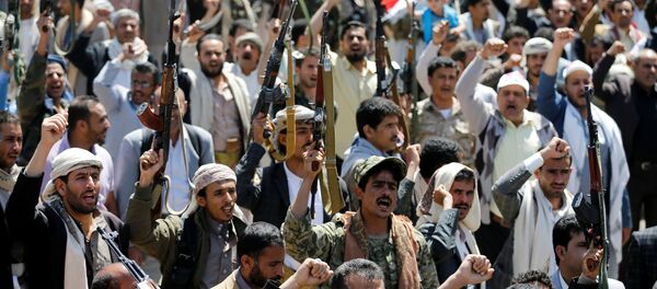 Armed people demonstrate outside the United Nations offices against Saudi-led air strikes on funeral hall in Sanaa, the capital of Yemen, October 9, 2016. Armed people demonstrate outside the United Nations offices against Saudi-led air strikes on funeral hall in Sanaa, the capital of Yemen, October 9, 2016. - Sputnik International
