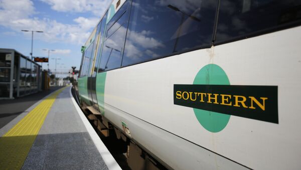 A Southern Rail logo is pictured on the side of a train carriage as t stands at a platform at East Croydon station, south of London - Sputnik International