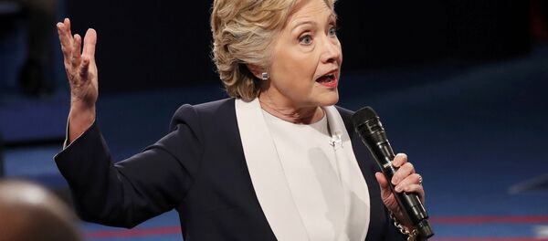 Democratic U.S. presidential nominee Hillary Clinton speaks to members of the audience during the presidential town hall debate with Republican US presidential nominee Donald Trump at Washington University in St. Louis, Missouri, US, October 9, 2016. Democratic U.S. presidential nominee Hillary Clinton speaks to members of the audience during the presidential town hall debate with Republican US presidential nominee Donald Trump at Washington University in St. Louis, Missouri, US, October 9, 2016. - Sputnik International