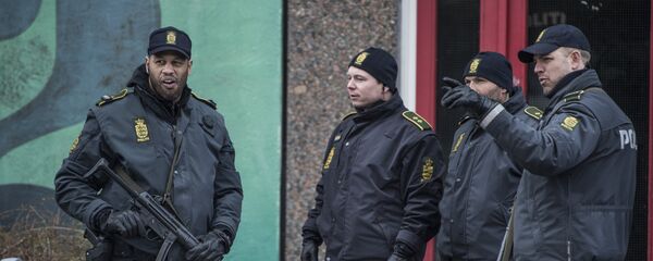 Policemen stand in front of a house in Ishoj, Denmark Policemen stand in front of a house in Ishoj, Denmark - Sputnik International