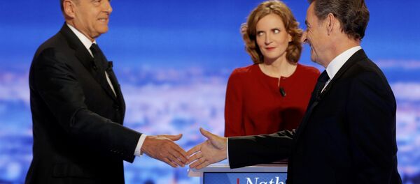 French politicians Alain Juppe (L) and Nicolas Sarkozy (R) shake hands as Nathalie Kosciusko-Morizet looks on before the first prime-time televised debate for the French conservative presidential primary in La Plaine Saint-Denis, near Paris, France, October 13, 2016. French politicians Alain Juppe (L) and Nicolas Sarkozy (R) shake hands as Nathalie Kosciusko-Morizet looks on before the first prime-time televised debate for the French conservative presidential primary in La Plaine Saint-Denis, near Paris, France, October 13, 2016. - Sputnik International
