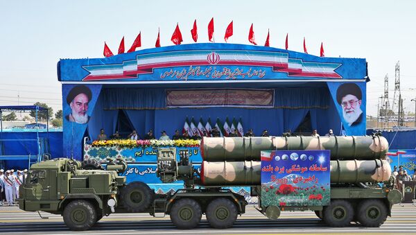 In front of the portraits of supreme leader Ayatollah Ali Khamenei, right, and late revolutionary founder Ayatollah Khomeini, left, a long-range, S-300 missile system is displayed by Iran's army during a military parade marking the 36th anniversary of Iraq's 1980 invasion of Iran, in front of the shrine of late revolutionary founder Ayatollah Khomeini, just outside Tehran, Iran, Wednesday, Sept. 21, 2016 - Sputnik International