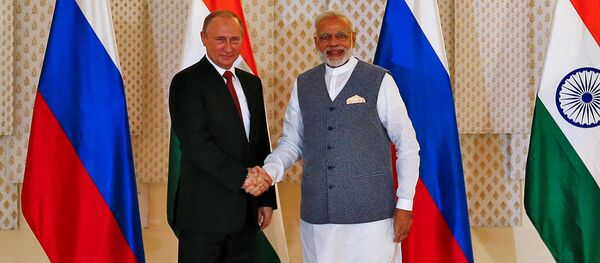 Russian President Vladimir Putin (L) shakes hand with India's Prime Minister Narendra Modi during a photo opportunity ahead of India-Russia Annual Summit in Benaulim, in the western state of Goa, India, October 15, 2016 Russian President Vladimir Putin (L) shakes hand with India's Prime Minister Narendra Modi during a photo opportunity ahead of India-Russia Annual Summit in Benaulim, in the western state of Goa, India, October 15, 2016 - Sputnik International