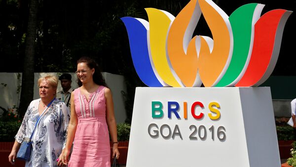 People walk out of one of the venues of BRICS (Brazil, Russia, India, China and South Africa) Summit, in Benaulim, in the western state of Goa, India, October 14, 2016 - Sputnik International