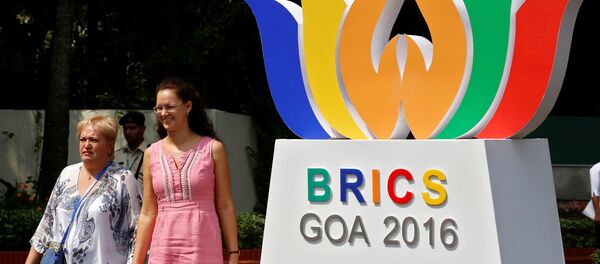People walk out of one of the venues of BRICS (Brazil, Russia, India, China and South Africa) Summit, in Benaulim, in the western state of Goa, India, October 14, 2016 - Sputnik International