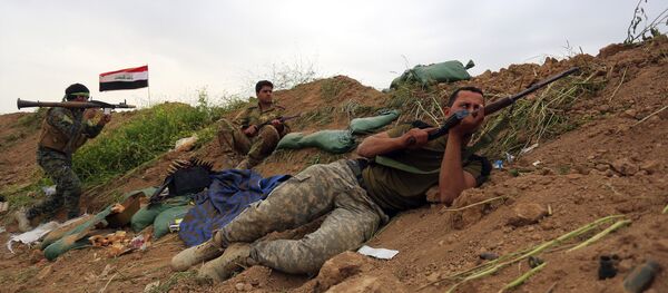 Iraqi Security forces and allied Popular Mobilization forces take combat positions during a military operation to regain control of Islamic State group held town of Besher outside the oil-rich city of Kirkuk (File) - Sputnik International