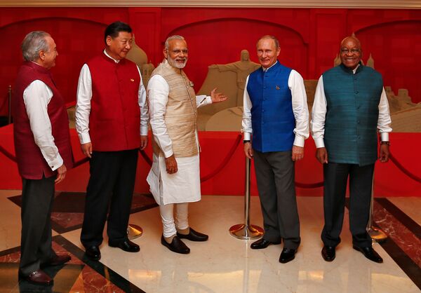 (L-R) Brazil's President Michel Temer, Chinese President Xi Jinping, Indian Prime Minister Narendra Modi, Russian President Vladimir Putin and South African President Jacob Zuma pose infront of a sand sculpture ahead of BRICS (Brazil, Russia, India, China and South Africa) Summit in Benaulim, in the western state of Goa, India, October 15, 2016 (L-R) Brazil's President Michel Temer, Chinese President Xi Jinping, Indian Prime Minister Narendra Modi, Russian President Vladimir Putin and South African President Jacob Zuma pose infront of a sand sculpture ahead of BRICS (Brazil, Russia, India, China and South Africa) Summit in Benaulim, in the western state of Goa, India, October 15, 2016 - Sputnik International