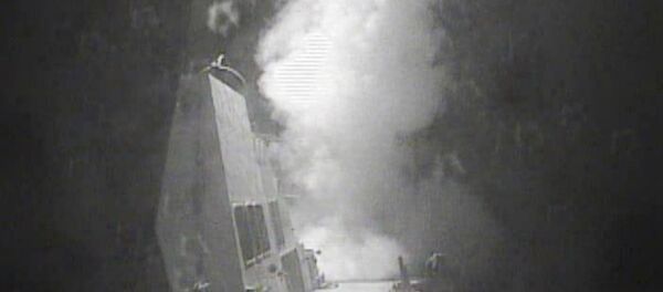 In this Thursday Oct. 13 photo released by US Navy, the guided missile destroyer USS Nitze (DDG 94) launches a strike against coastal sites in Houthi-controlled territory on Yemen's Red Sea coast - Sputnik International