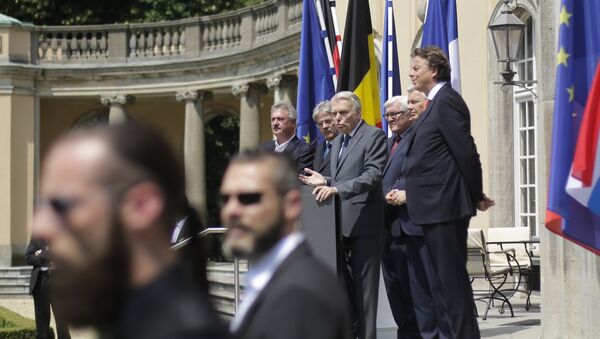 Security guards stand in front of he Foreign Ministers from EU's founding six Jean Asselborn from Luxemburg, Paolo Gentiloni from Italy, Jean-Marc Ayrault from France, Frank-Walter Steinmeier from Germany, Didier Reynders from Belgium and Bert Koenders from the Netherlands, as they brief the media after a meeting on the so-called Brexit in Berlin, Germany, Saturday, June 25, 2016 - Sputnik International