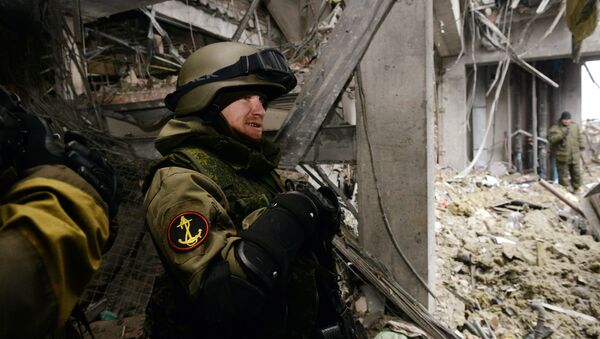 Arseny Pavlov, also known by his nickname 'Motorola', stands inside a destroyed airport building in the eastern Ukrainian city of Donetsk, on February 26, 2015 - Sputnik International