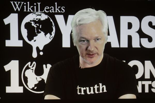 In this Oct. 4, 2016 file photo, WikiLeaks founder Julian Assange participates via video link at a news conference marking the 10th anniversary of the secrecy-spilling group in Berlin. WikiLeaks said on Monday, Oct. 17, 2016, that Assange's internet access has been cut by an unidentified state actor. In this Oct. 4, 2016 file photo, WikiLeaks founder Julian Assange participates via video link at a news conference marking the 10th anniversary of the secrecy-spilling group in Berlin. WikiLeaks said on Monday, Oct. 17, 2016, that Assange's internet access has been cut by an unidentified state actor. - Sputnik International