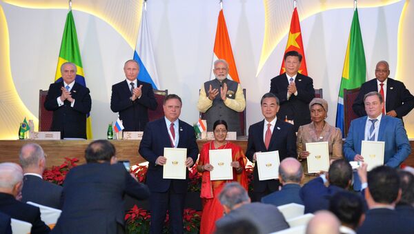 At this October 16, 2016 photo Russian President Vladimir Putin is seen at the ceremony of signing joint documents following a meeting of BRICS leaders at Taj Exotica Goa hotel, India - Sputnik International