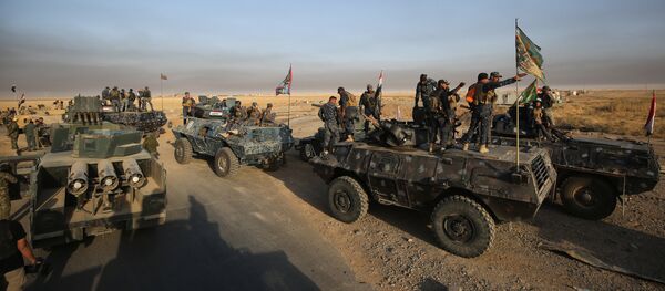 Iraqi forces deploy in the area of al-Shourah, some 45 kms south of Mosul, as they advance towards the city to retake it from the Islamic State (IS) group jihadists, on October 17, 2016. Iraqi Prime Minister Haider al-Abadi announced earlier in the day that the long-awaited operation to recapture Mosul was under way Iraqi forces deploy in the area of al-Shourah, some 45 kms south of Mosul, as they advance towards the city to retake it from the Islamic State (IS) group jihadists, on October 17, 2016. Iraqi Prime Minister Haider al-Abadi announced earlier in the day that the long-awaited operation to recapture Mosul was under way - Sputnik International