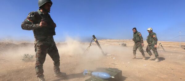 Iraqi Kurdish Peshmerga fighters fire a mortar shell from the top of Mount Zardak, about 25 kilometres east of Mosul, as they take part in an operation against Islamic State (IS) group jihadists, on October 17, 2016 Iraqi Kurdish Peshmerga fighters fire a mortar shell from the top of Mount Zardak, about 25 kilometres east of Mosul, as they take part in an operation against Islamic State (IS) group jihadists, on October 17, 2016 - Sputnik International