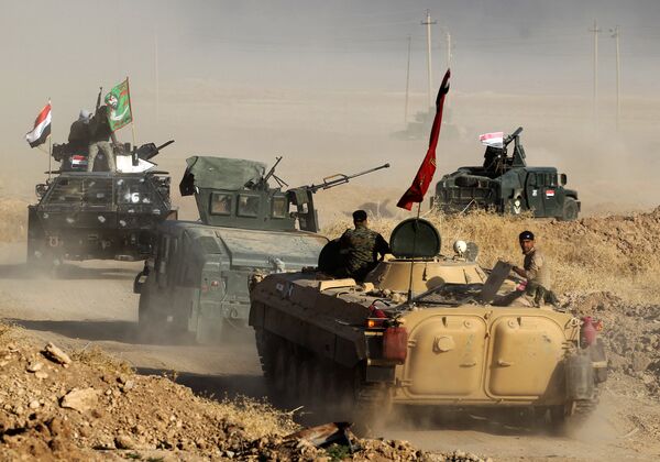 Iraqi forces deploy in the area of al-Shourah, some 45 kms south of Mosul, as they advance towards the city to retake it from the Islamic State (IS) group jihadists, on October 17, 2016 Iraqi forces deploy in the area of al-Shourah, some 45 kms south of Mosul, as they advance towards the city to retake it from the Islamic State (IS) group jihadists, on October 17, 2016 - Sputnik International