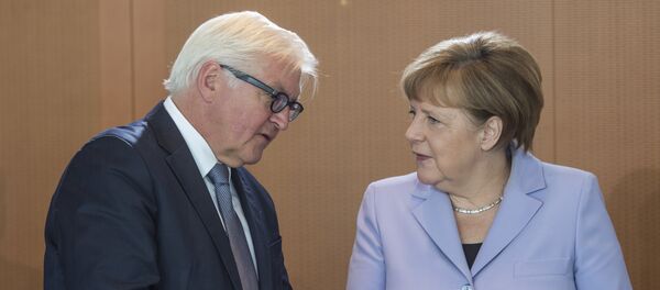 German Chancellor Angela Merkel (R) chats with German Foreign Minister Frank-Walter Steinmeier as she arrives for a weekly meeting of the German cabinet at the chancellery in Berlin on May 11, 2016 German Chancellor Angela Merkel (R) chats with German Foreign Minister Frank-Walter Steinmeier as she arrives for a weekly meeting of the German cabinet at the chancellery in Berlin on May 11, 2016 - Sputnik International