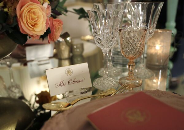 A place card for Mrs. Obama is seen on a table during a preview in advance of the State Dinner in honor of the Official Visit of Italian Prime Minister Matteo Renzi and his wife Agnese Landini in the State Dining Room of the White House in Washington, Monday, Oct. 17, 2016 - Sputnik International