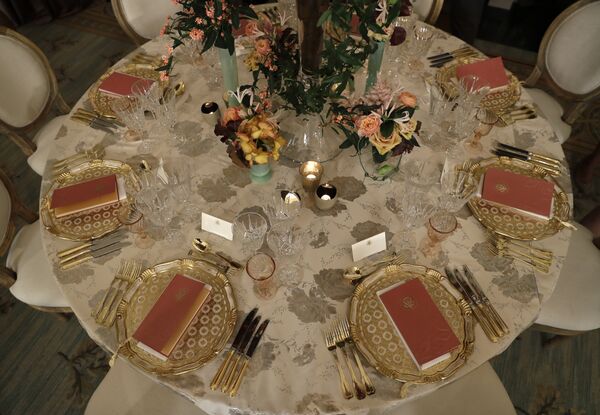 A table is set with candles and centerpieces during a preview in advance of the State Dinner in honor of the Official Visit of Italian Prime Minister Matteo Renzi and his wife Agnese Landini, Monday, Oct. 17, 2016, in the State Dining Room of the White House in Washington - Sputnik International
