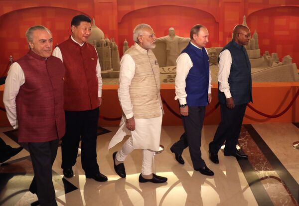 Leaders of BRICS nations, from left, Brazilian President Michel Temer, Chinese President Xi Jinping, Indian Prime Minister Narendra Modi, Russian President Vladimir Putin and South African President Jacob Zuma walk past sand sculptures of famous landmarks of BRICS nations created by Indian sand artist Sudarsan Pattnaik, prior to dinner hosted by Modi in Goa, India, Saturday, Oct. 15, 2016 Leaders of BRICS nations, from left, Brazilian President Michel Temer, Chinese President Xi Jinping, Indian Prime Minister Narendra Modi, Russian President Vladimir Putin and South African President Jacob Zuma walk past sand sculptures of famous landmarks of BRICS nations created by Indian sand artist Sudarsan Pattnaik, prior to dinner hosted by Modi in Goa, India, Saturday, Oct. 15, 2016 - Sputnik International