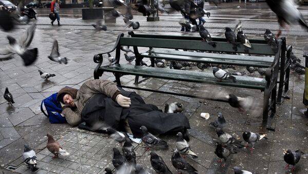 This is a January 2012 file photo of a homeless man sleeping in Townhall Square in Copenhagen - Sputnik International