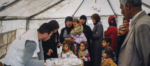 Civilians displaced by heavy fighting between Iraqi security forces and ISIS militants wait to be seen by a doctor in a tent set up by MSF, or Doctors Without Borders, to provide medical aid at a shelter in Makhmour, near Mosul, Iraq, March 28, 2016 Civilians displaced by heavy fighting between Iraqi security forces and ISIS militants wait to be seen by a doctor in a tent set up by MSF, or Doctors Without Borders, to provide medical aid at a shelter in Makhmour, near Mosul, Iraq, March 28, 2016 - Sputnik International