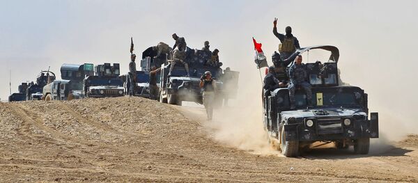 Iraqi forces hold a position near the village of Tall al-Tibah, some 30 kilometres south of Mosul during an operation against Islamic State (IS) group jihadists to retake the main hub city Iraqi forces hold a position near the village of Tall al-Tibah, some 30 kilometres south of Mosul during an operation against Islamic State (IS) group jihadists to retake the main hub city - Sputnik International