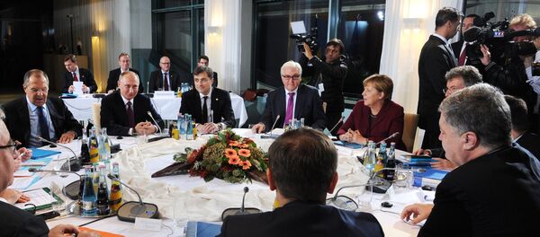 Russian President Vladimir Putin, German Chancellor Angela Merkel, background 2nd right, and Ukrainian President Petro Poroshenko, foreground right, during the Normandy format meeting between the leaders of Germany, Russia, Ukraine and France on settling the Ukrainian conflict, at the Paul Loebe Haus parliamentary building in Berlin, October 19, 2016. Background 3rd right: German Foreign Minister Frank-Walter Steinmeier. Background left: Russian Foreign Minister Sergei Lavrov. Background 3rd left: Russian Presidential Aide Vladislav Surkov. - Sputnik International