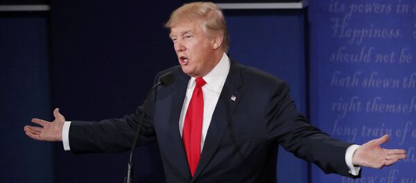 Republican U.S. presidential nominee Donald Trumpspeaks as Democratic U.S. presidential nominee Hillary Clinton listens during their third and final 2016 presidential campaign debate at UNLV in Las Vegas, Nevada, U.S., October 19, 2016 - Sputnik International