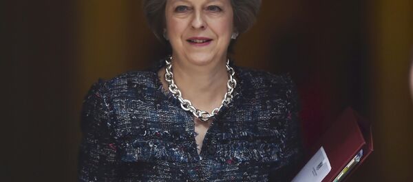 Britain's Prime Minister Theresa May leaves Number 10 Downing Street to attend Prime Minister's Questions at parliament in London, Britain October 19, 2016. Britain's Prime Minister Theresa May leaves Number 10 Downing Street to attend Prime Minister's Questions at parliament in London, Britain October 19, 2016. - Sputnik International