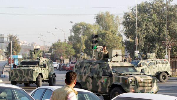 Military vehicles of peshmerga forces are seen at a site of an attack by Islamic State militants in Kirkuk, Iraq, October 21, 2016. - Sputnik International