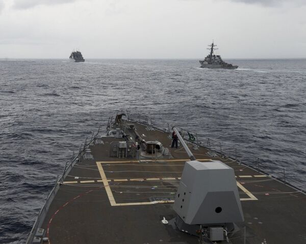 the guided missile destroyer USS Decatur, right, pulling into position behind the Military Sealift Command USNS Matthew Perry, during a replenishment-at-sea, seen from the bridge of the guided-missile destroyer USS Spruance, in the South China Sea. the guided missile destroyer USS Decatur, right, pulling into position behind the Military Sealift Command USNS Matthew Perry, during a replenishment-at-sea, seen from the bridge of the guided-missile destroyer USS Spruance, in the South China Sea. - Sputnik International