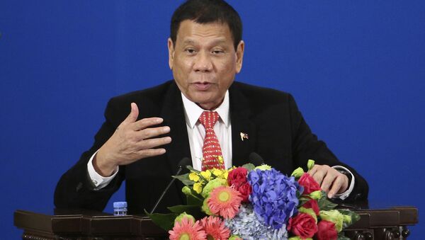 Philippine President Rodrigo Duterte delivers a speech during the Philippines-China Trade and Investment Forum at the Great Hall of the People in Beijing - Sputnik International
