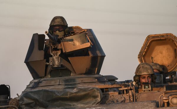 Turkish soldiers stand in a Turkish army tank driving back to Turkey from the Syrian-Turkish border town of Jarabulus in the Turkish-Syrian border town of Karkamis Turkish soldiers stand in a Turkish army tank driving back to Turkey from the Syrian-Turkish border town of Jarabulus in the Turkish-Syrian border town of Karkamis - Sputnik International