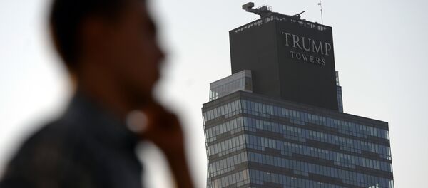 A man walks past the Trump Towers building in Istanbul on July 30, 2015 - Sputnik International