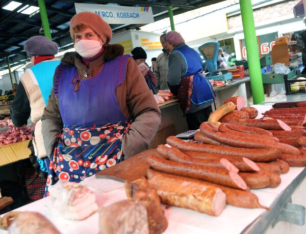 A woman wears a mask on a market in the western Ukrainian city of Lviv (File) A woman wears a mask on a market in the western Ukrainian city of Lviv (File) - Sputnik International